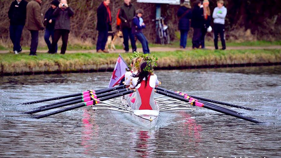 Yasmin (at bow) rowing with her crew